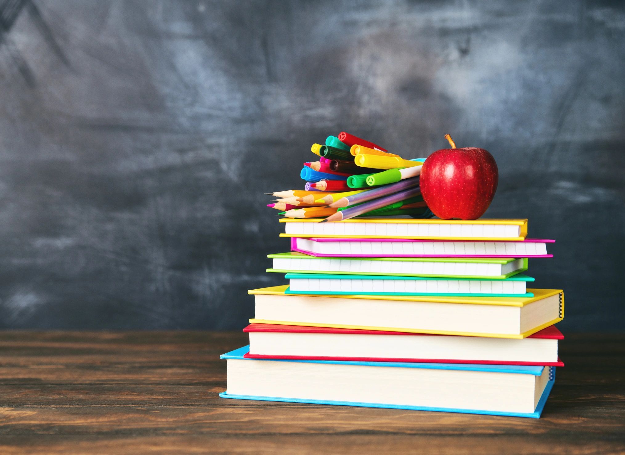Books and writing materials on a desk