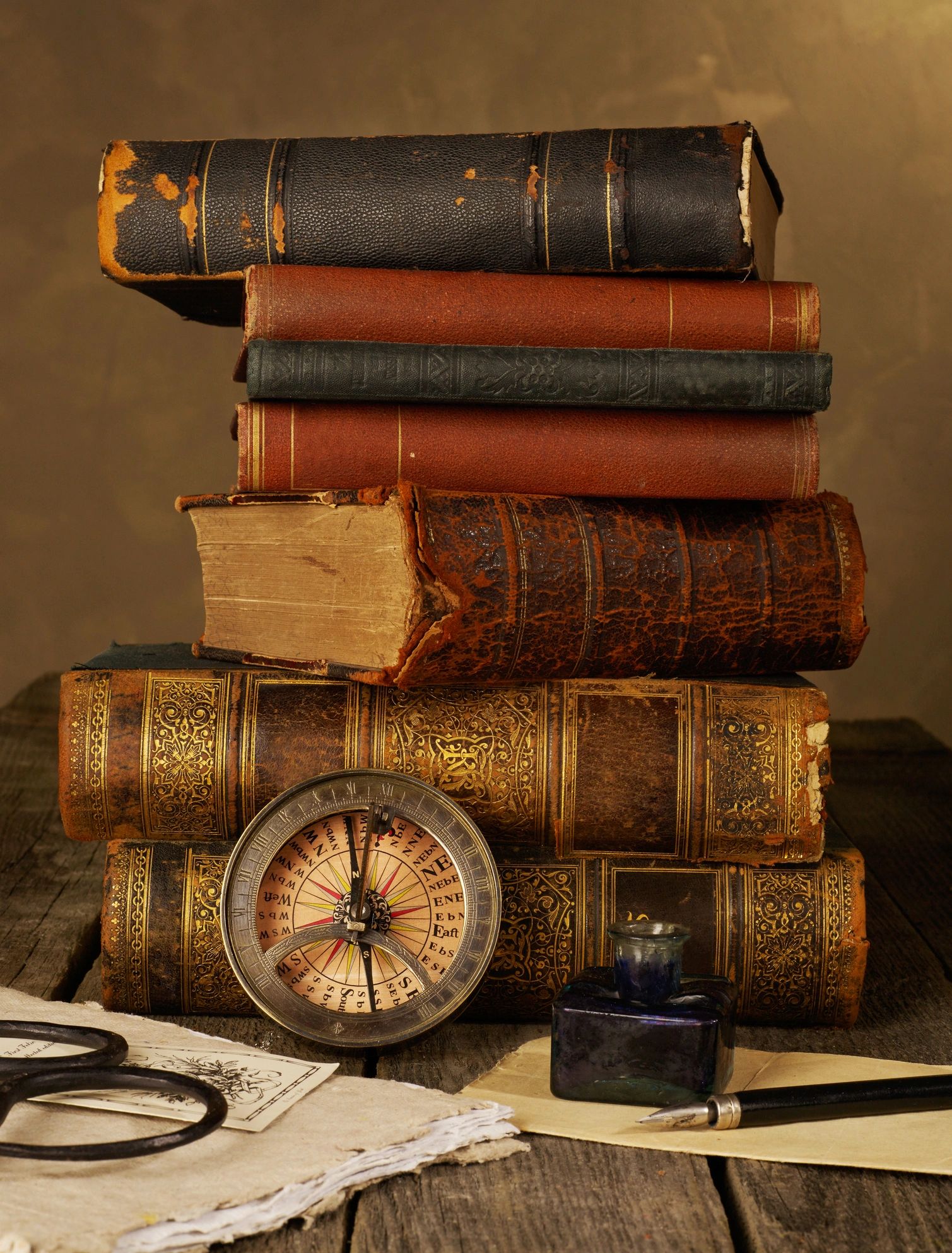 Books and writing instruments representing research in practice